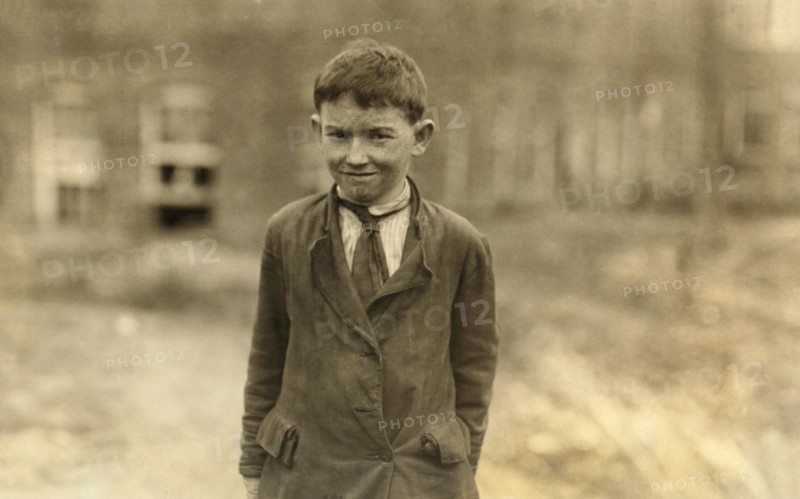 Earl Carpenter, Half-Length Portrait, Young Doffer in Cannon Mill, Concord, North Carolina, USA, Lewis Hine for National Child Labor Committee, October 1912