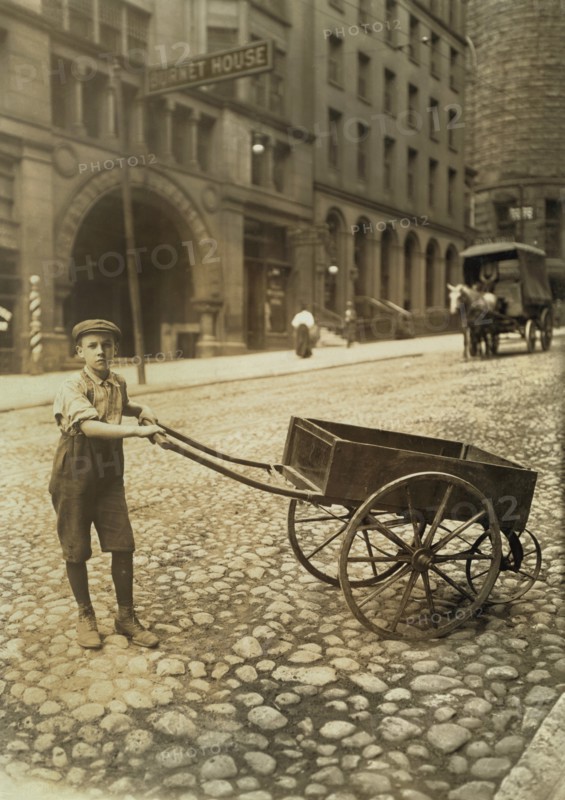 George Rabholz, 14 years old, Delivers Bundles for Printing Office, Cincinnati, Ohio, USA, Lewis Hine for National Child Labor Committee, August 1908