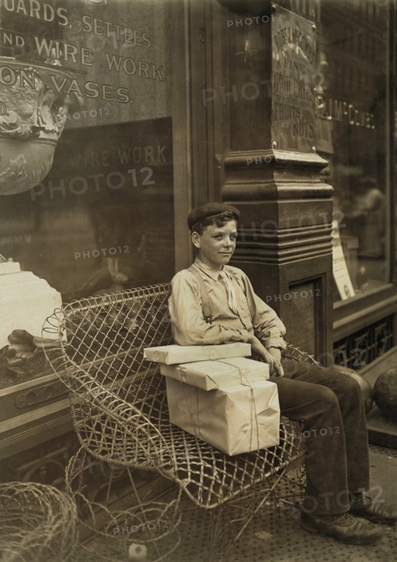 Young Delivery Boy Taking Break while Delivering Packages, Newport, Kentucky, USA, Lewis Hine for National Child Labor Committee, August 1909