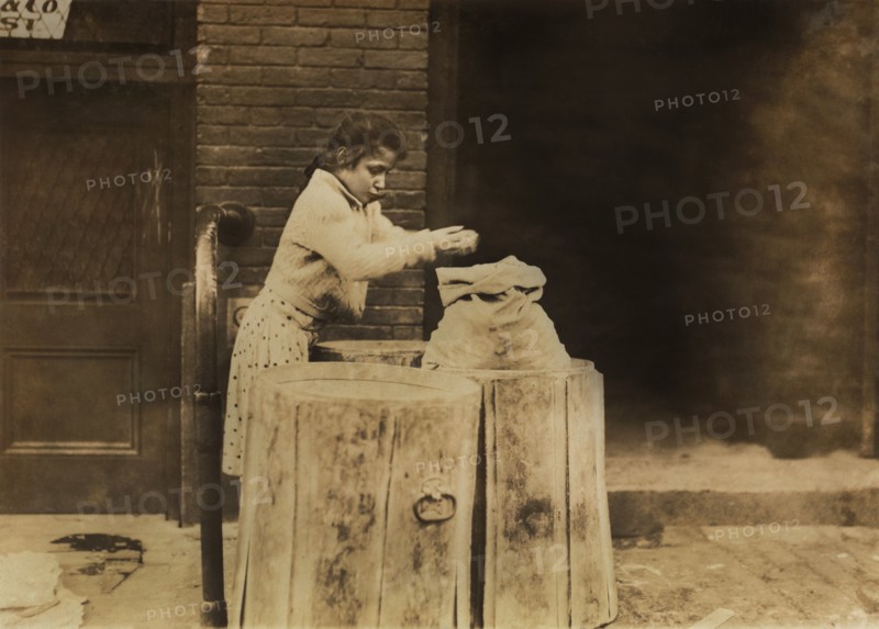 Young Girl Picking over Ash Barrels, Boston, Massachusetts, USA, Lewis Hine for National Child Labor Committee, October 1909
