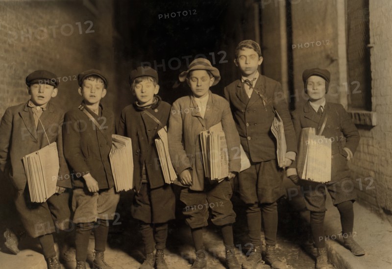 Group of Young Newsboys Selling Newspapers after 9:00 p.m., Full-Length Portrait, Newark, New Jersey, USA, Lewis Hine for National Child Labor Committee, December 1909
