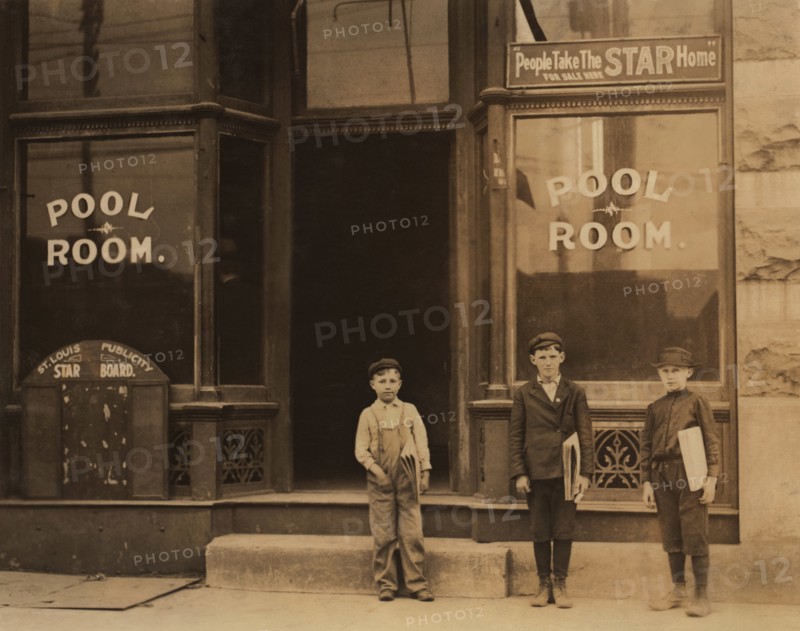Three Young Newsboys, Portrait Standing outside Pool Hall after Receiving Afternoon Newspapers, Boys were Smoking and Playing Pool while Waiting for Papers, Youngest Boy is 9 years old and Sells until 9:00 p.m., Chouteau and Manchester Streets, St. Louis, Missouri, USA, Lewis Hine for National Child Labor Committee, May 1910