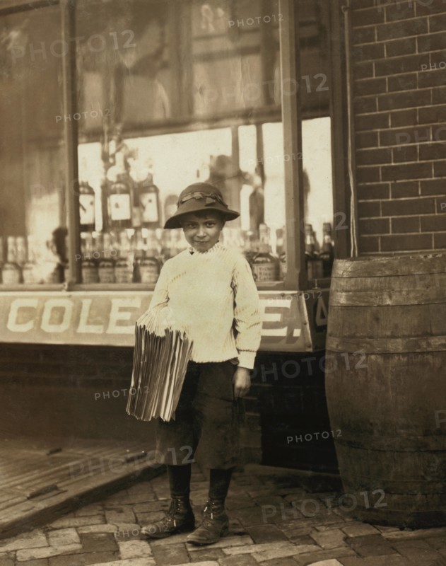James Morgan, 9-year-old Newsboy, Selling Newspapers for 4 years, Works 6 hours per Day, Visits Saloons, Full-Length Portrait, Wilmington, Delaware, USA, Lewis Hine for National Child Labor Committee, May 1910
