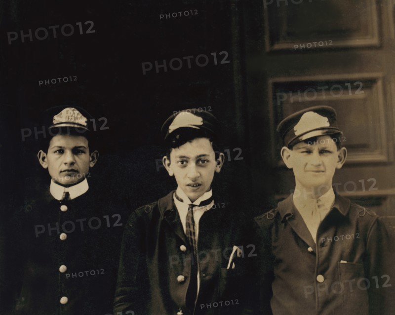 Three Typical A.D.T. Boys, Half-Length Portrait, Broadway near 40th Street, New York City, New York, USA, Lewis Hine for National Child Labor Committee, July 1910
