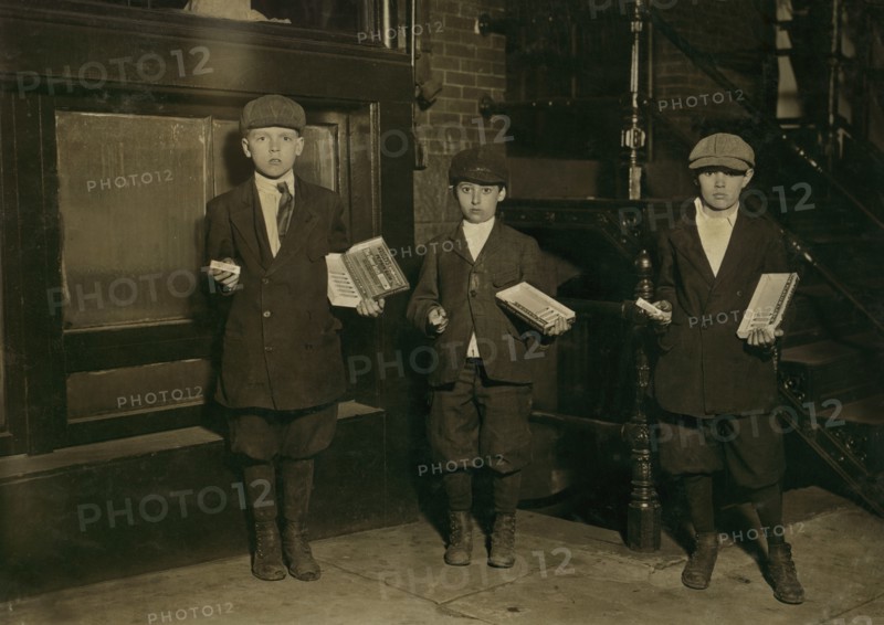 Three Young Boys Selling Gum Near National Theater at Night, Full-Length Portrait, Washington DC, USA, Lewis Hine for National Child Labor Committee, April 1912