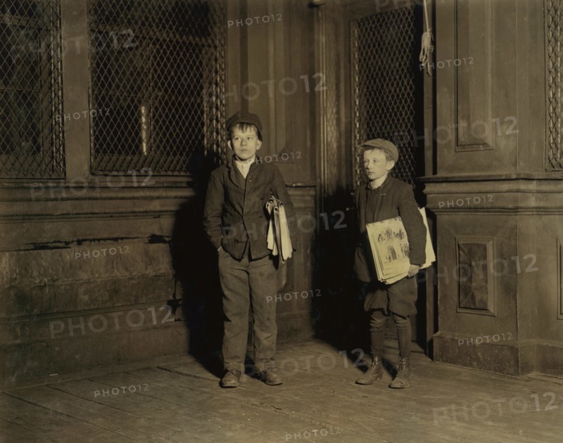 Peter (left), 15 years old, Charles, 11 years old, Employed in Camphor Works, Sells Newspapers Saturday Nights until 3:00 a.m., Full-Length Portrait Selling Newspapers at 1:30 a.m., Newark, New Jersey, USA, Lewis Hine for National Child Labor Committee, November 1912