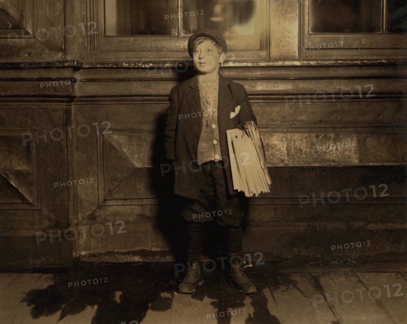 Joseph Weiss, 11-year-old Newsboy, Full-Length Portrait Selling Newspapers Late at Night, Newark, New Jersey, USA, Lewis Hine for National Child Labor Committee, December 1912