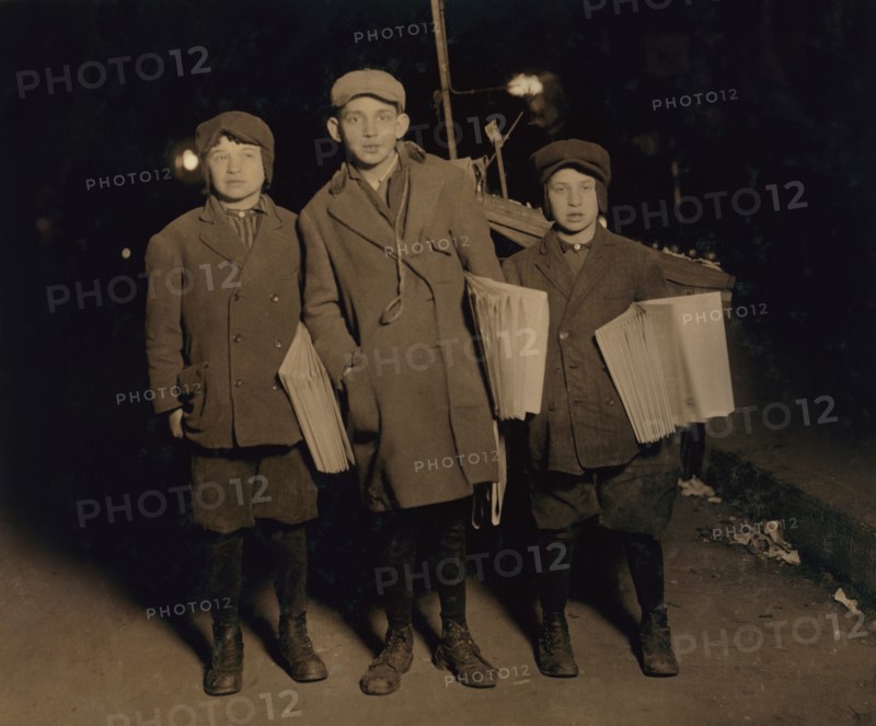 Three Young Boys Selling "Warheit" Jewish Newspapers at Midnight, Full-Length Portrait, Delancey Street, New York City, New York, USA, Lewis Hine for National Child Labor Committee, March 1913
