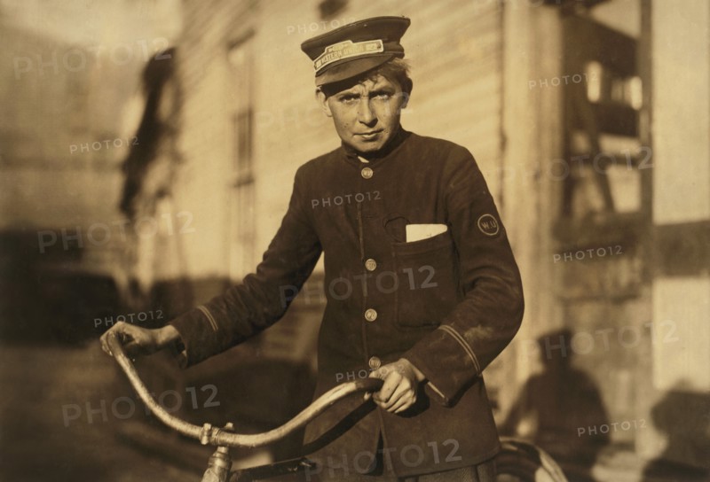 Western Union Messenger, 14 years old, Portrait with Bicycle, Houston, Texas, USA, Lewis Hine for National Child Labor Committee, October 1913