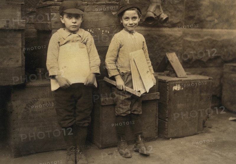 Two Young Newsboys, 7 and 9 years old, Full-Length Portrait Selling Newspapers, New Orleans, Louisiana, USA, Lewis Hine for National Child Labor Committee, November 1913