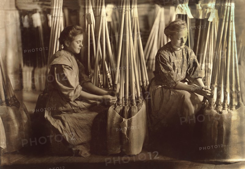 Two Girls Packing Brooms in Packing Department, S.W. Brown Manufacturing Company, Evansville, Indiana, USA, Lewis Hine for National Child Labor Committee, October 1908