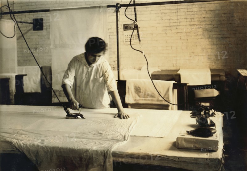Sadie McGurin, 15 years old, Pressing Curtains, Boutwell, Fairclough & Gold, Boston, Massachusetts, USA, Lewis Hine for National Child Labor Committee, January 1917
