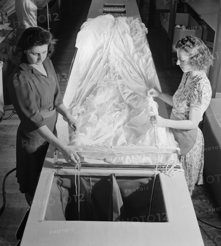 Two Female Workers Threading Shroud Cords through Parachute Fabric, Pioneer Parachute Company, Manchester, Connecticut, USA, William M. Rittase for Office of War Information, August 1942