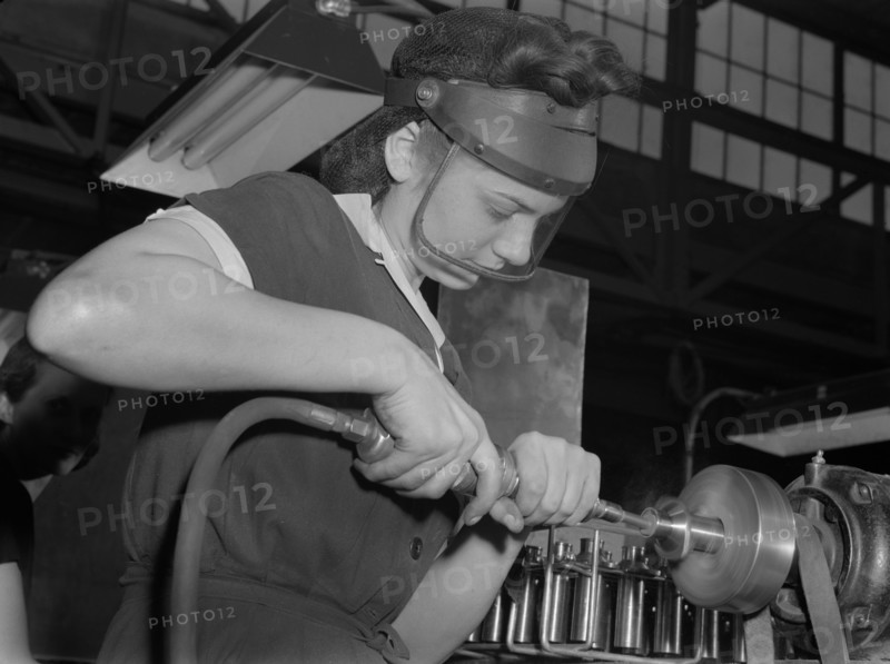 Female Worker Operating Compressed Air Machine at Midwest Aircraft Motor Plant, Ann Rosener, Office of War Information, August 1942