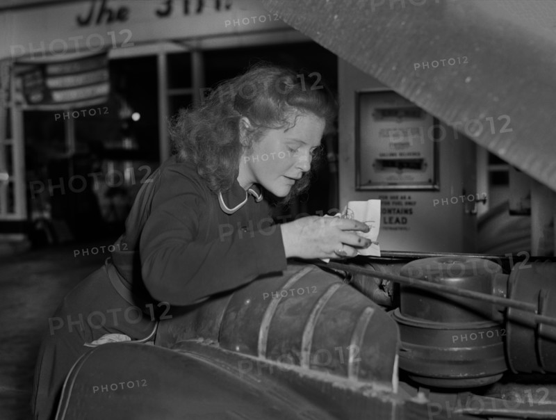 Virginia Excell, formerly a Butcher, now a Service Station Attendant as new Jobs have opened up for Women during WWII, Checking Car Engine, East Liverpool, Ohio, USA, Ann Rosener, Office of War Information, September 1942