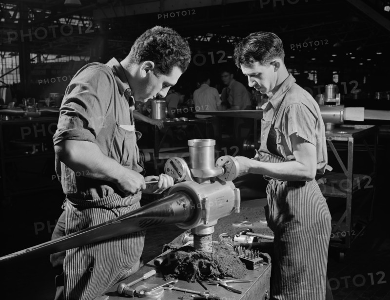 Leo Diana and George O'Meara working Assembling Propeller Blade for Military Aircraft at Manufacturing Plant, Hartford, Connecticut, USA, Andreas Feininger for Office of War Information, June 1942