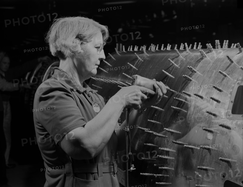 Female Worker Drilling Holes in B-17F (Flying Fortress), Heavy Bomber, Boeing, Seattle, Washington, USA, Andreas Feininger for Office of War Information, December 1942
