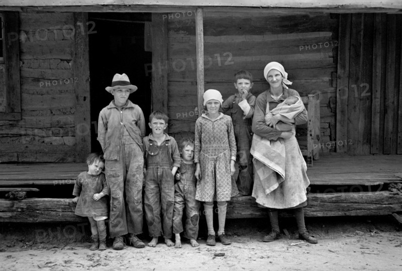Portrait of Family in Front of Rural Cabin on Natchez Trace Project, near Lexington, Tennessee, USA, Carl Mydans for U.S. Resettlement Administration, March 1936