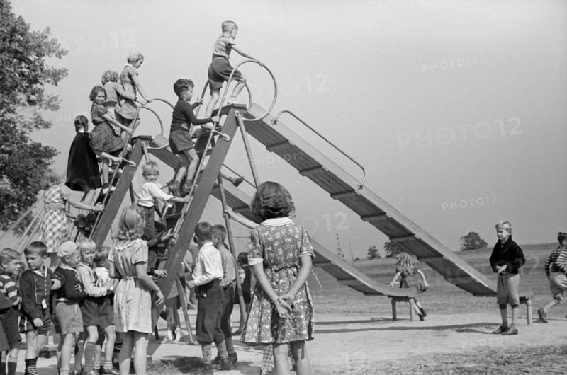 Children Playing at School Playground, Greenhills, Ohio, USA, a Greenbelt Community Constructed by U.S. Department of Agriculture as Part of President Franklin Roosevelt's New Deal, John Vachon for U.S. Resettlement Administration, October 1938