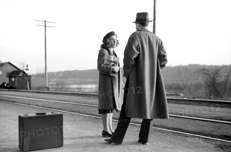 Couple Waiting for Train to Minneapolis, East Dubuque, Illinois, USA, John Vachon for Farm Security Administration, April 1940