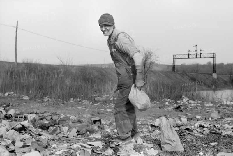 Man Foraging for Food at City Dump, Dubuque, Iowa, USA, John Vachon for Farm Security Administration, April 1940