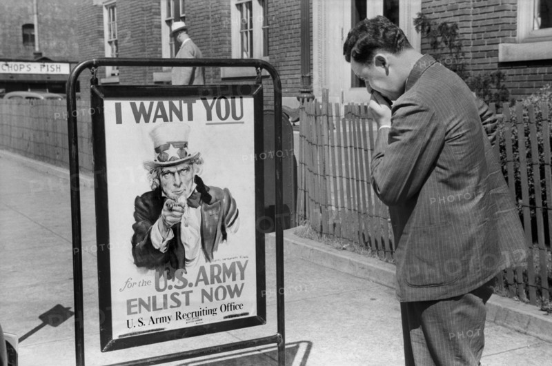 Man Looking at U.S. Army Recruitment Sign, Benton Harbor, Michigan, USA, John Vachon for Farm Security Administration July 1940