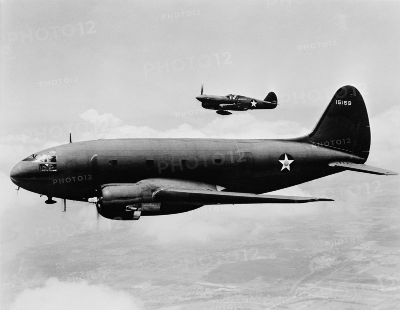 C-46 Transport Plane with P-40 Single-Engine Fighter Plane in Background, Office of War Information, March 1943