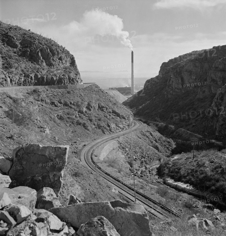 Industrial Railroad and Smokestack of Large Copper Smelter that Supplies Great Quantities of Copper so vital to War Effort, Phelps-Dodge Mining Company, Morenci, Arizona, USA, Fritz Henle for Office of War Information, December 1942