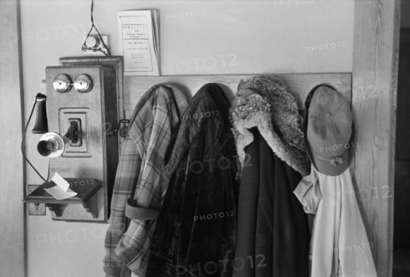 Telephone and Coats on Rack, Tenant Farmer's Farmhouse, Dickens, Iowa, USA, Russell Lee, U.S. Resettlement Administration, December 1936