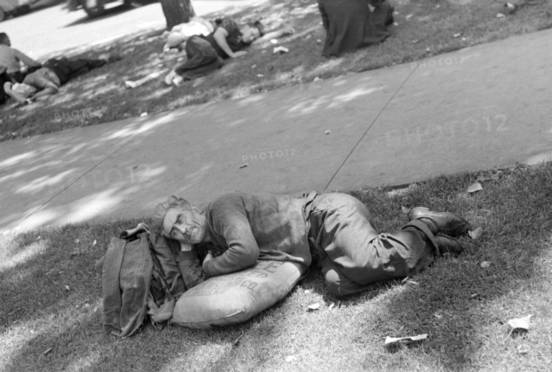 Man Resting on Sack of Seed in Park, Minneapolis, Minnesota, USA, Russell Lee, U.S. Resettlement Administration, August 1937