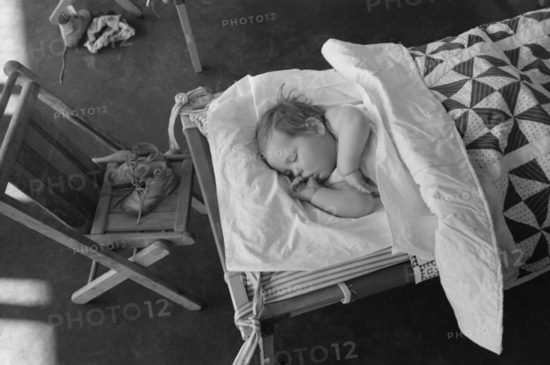 Child Napping at Nursery School, FSA Farm Workers Community, Woodville, California, USA, Russell Lee, Farm Security Administration, March 1942
