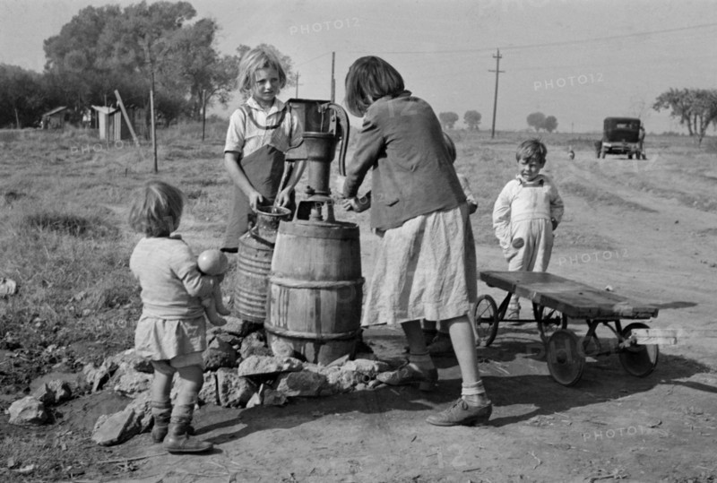Children of Migrant Workers Fetching Water, American River Migrant Camp, San Joaquin Valley, California, USA, Dorothea Lange, Farm Security Administration, November 1936