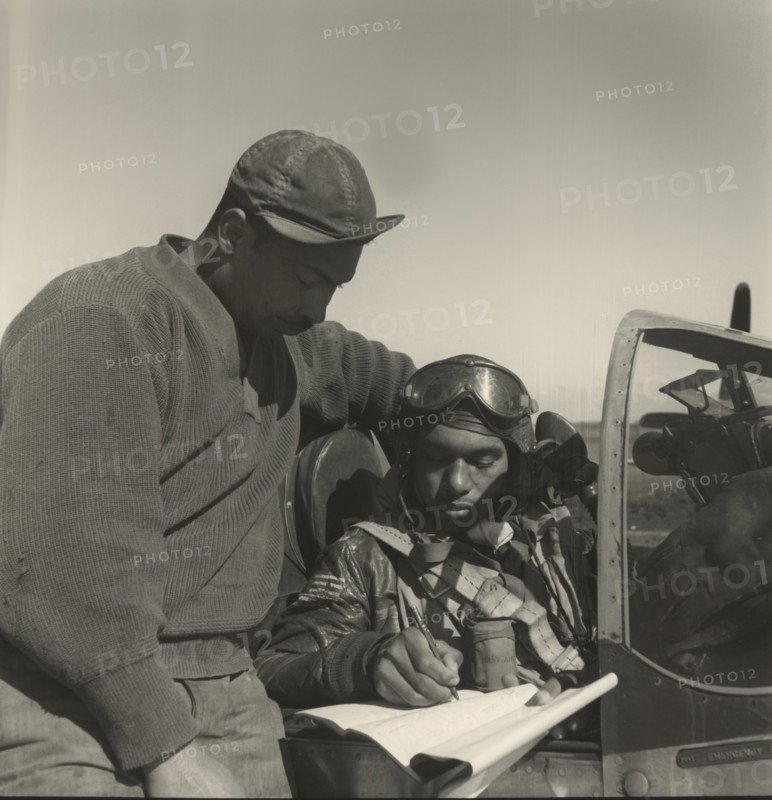 Pilot from 332nd Fighter Group Signing Form One Book, Indicating any Discrepancies of Aircraft, Prior to Take-off, Ramitelli, Italy, Toni Frissell, March 1945