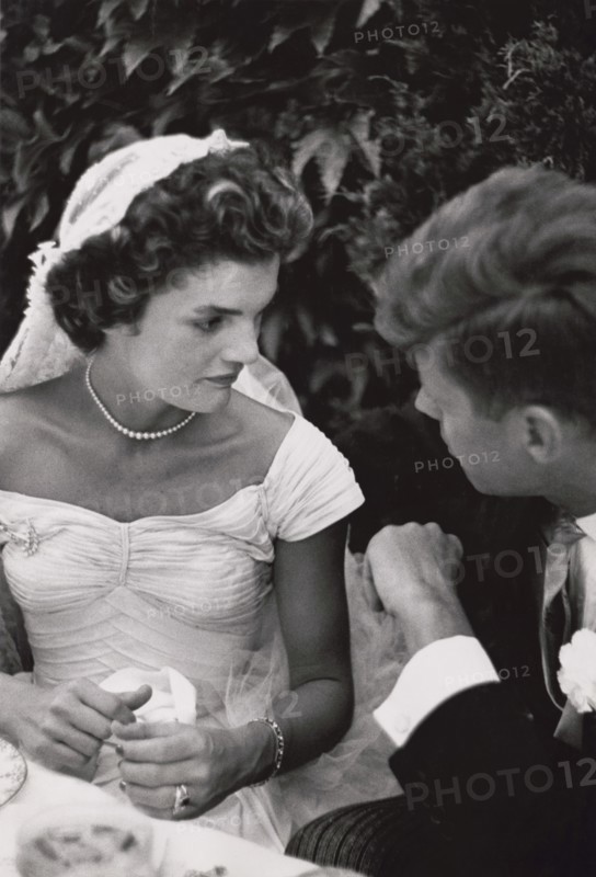 Jacqueline Bouvier Kennedy and Senator John F. Kennedy Talking at their Wedding Reception, Newport, Rhode Island, USA, by Toni Frissell, September 12, 1953