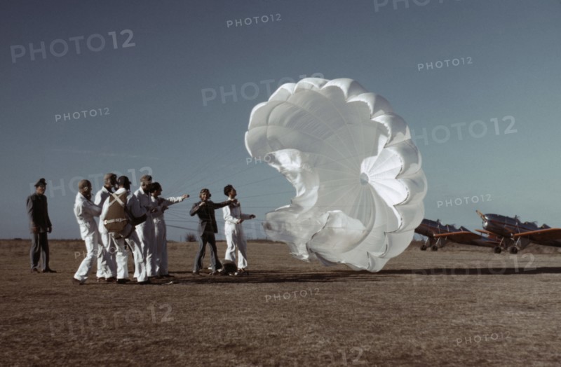 Instructor Explaining Operation of Parachute to Student Pilots, Meacham Field, Fort Worth, Texas, USA, Arthur Rothstein for Farm Security Administration, January 1942