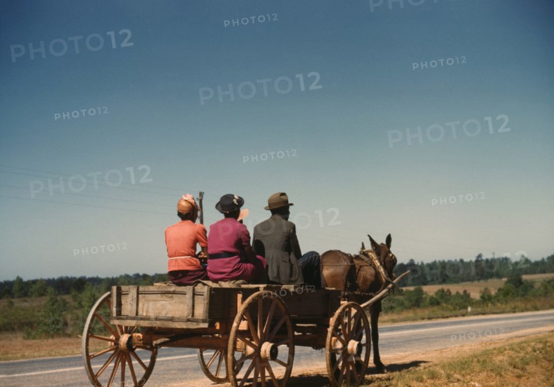 Three People Going to Town in Horse-Drawn Wagon on Saturday Afternoon, Greene County, Georgia, USA, by Jack Delano for Farm Security Administration, May 1941