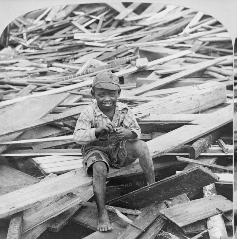 Portrait of Young Boy Sitting on Pile of Debris after Hurricane, Galveston, Texas, USA, Single Image of Stereo Card, 1900