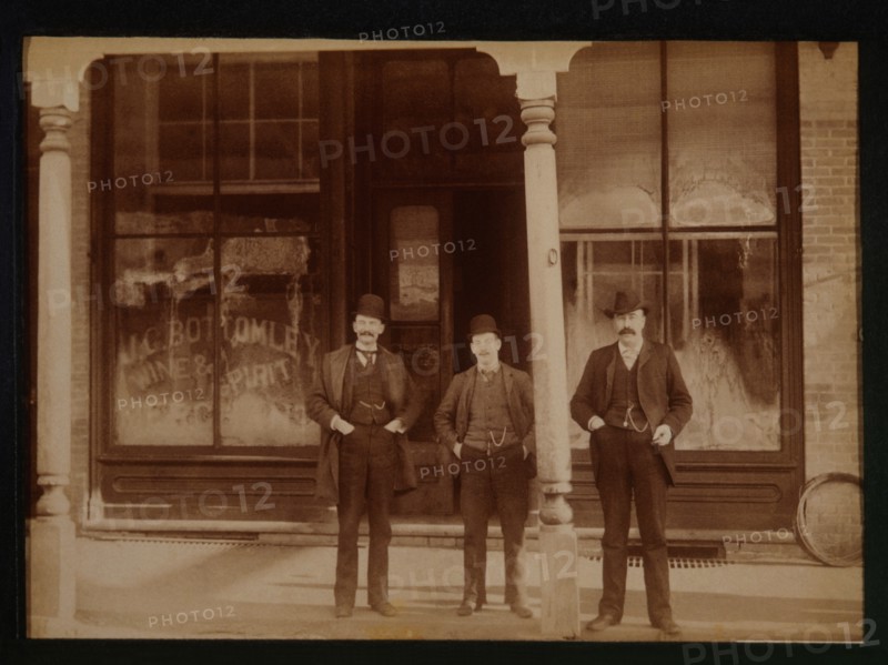 Three Men Standing in Front of Liquor Store, Aylmer, Ontario, Canada, 1900