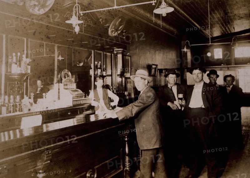 Men Drinking in Bar, USA, circa 1910