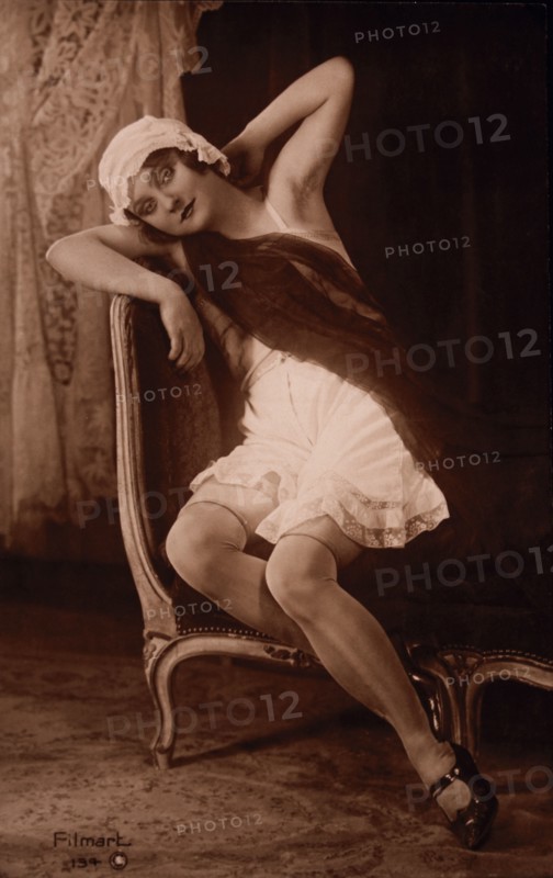 French Female Lingerie Model Sitting in Chair, circa 1910's