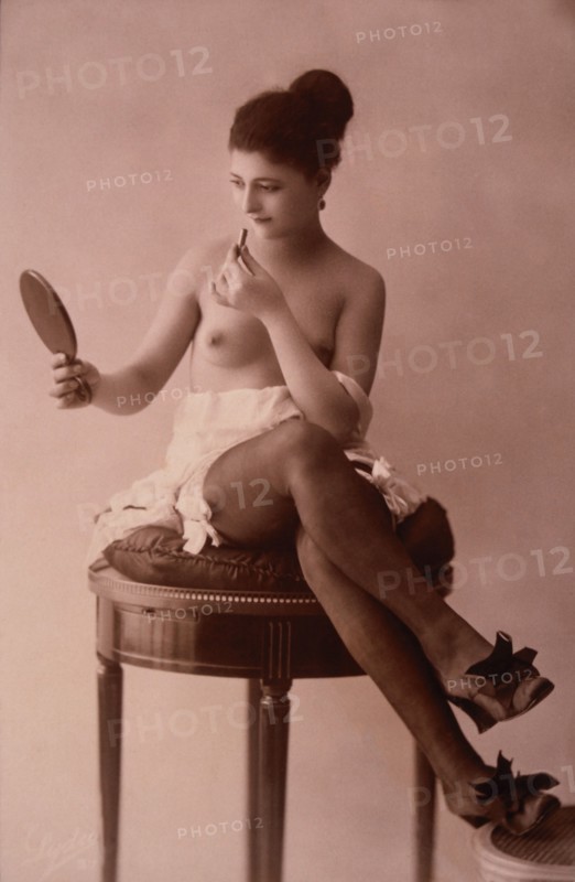 Partially Nude French Lingerie Model with Mirror and Lipstick, 1920