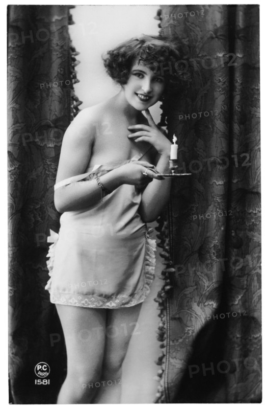 French Lingerie Model Smiling and Holding Candle, 1920