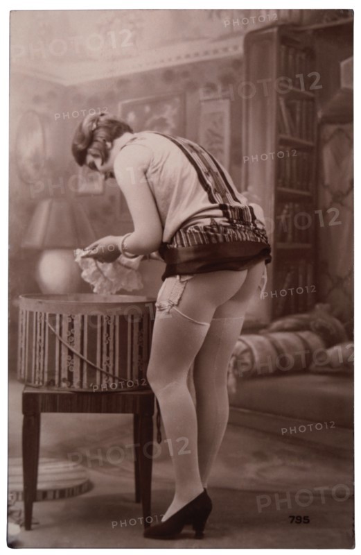 French Lingerie Model Leaning Over Hatbox, 1920