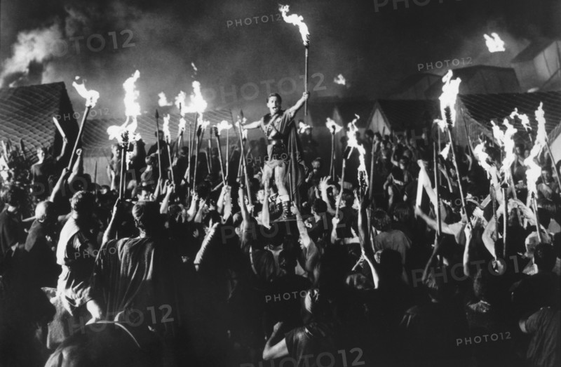 Kirk Douglas and Crowd at Night, on-set of Film, "Spartacus", 1960