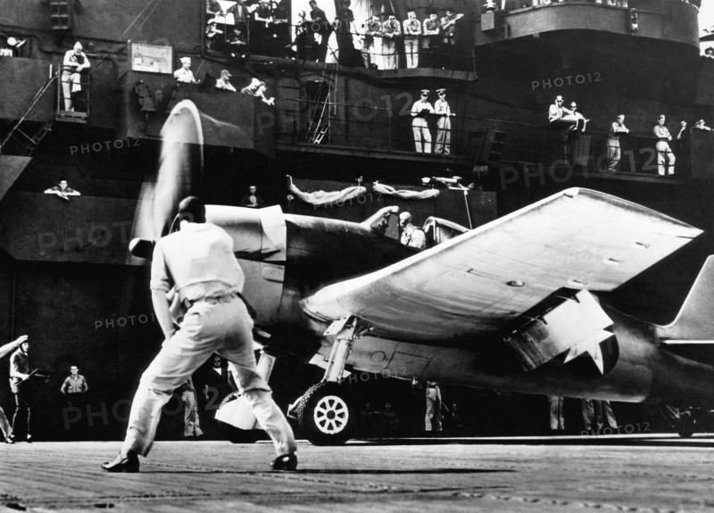 Soldiers and Airplane on Deck of the USS Yorktown, on-set of the Documentary Film, "The Fighting Lady", 1944