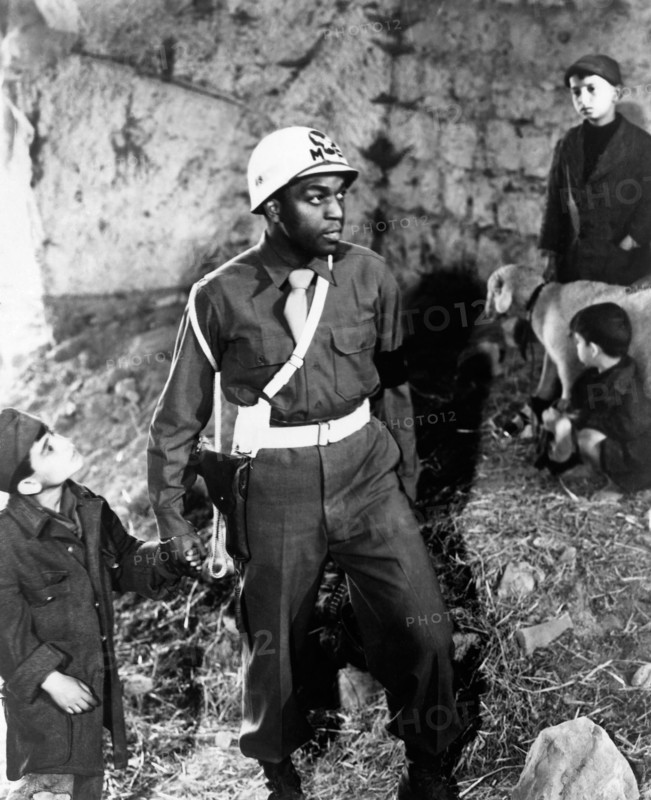 Dotts Johnson, on-set holding Hands with Young Boy of the Film, "Paisan", 1946