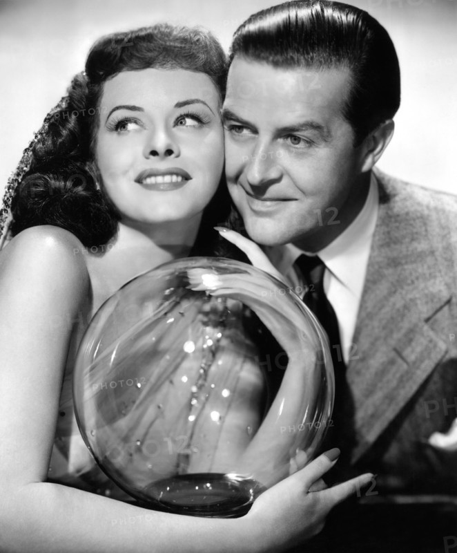 Paulette Goddard, Ray Milland, on-set of the Film, "The Crystal Ball", 1943