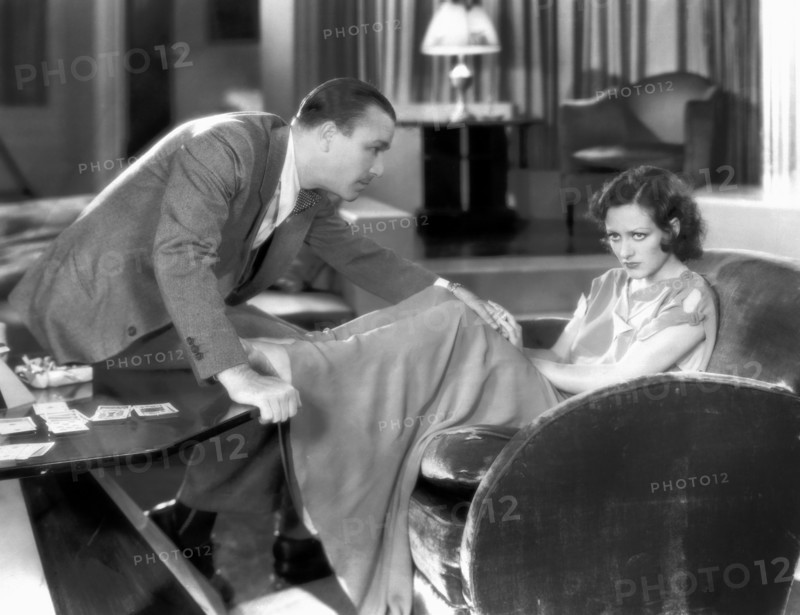 Robert Armstrong, Joan Crawford, on-set of the Film, "Paid", 1930
