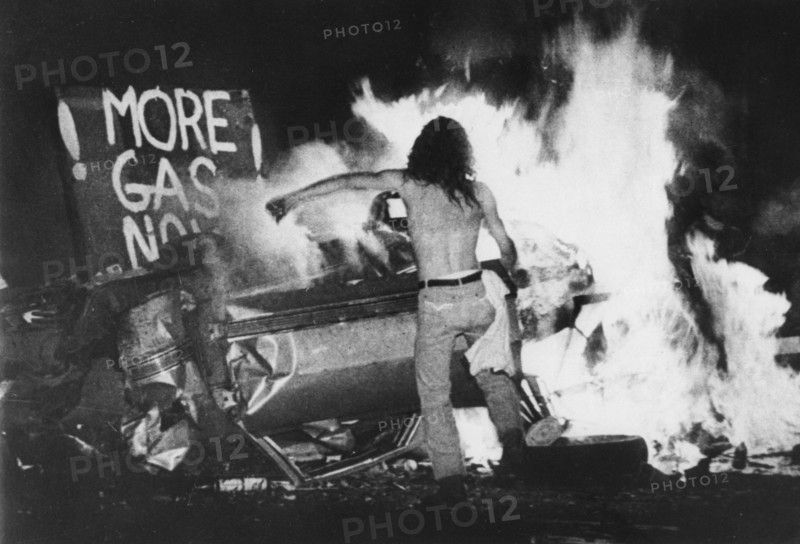Gas Shortage Demonstrator in Front of Burning Car During Riot at Night, Levittown, Pennsylvania, USA, 1979