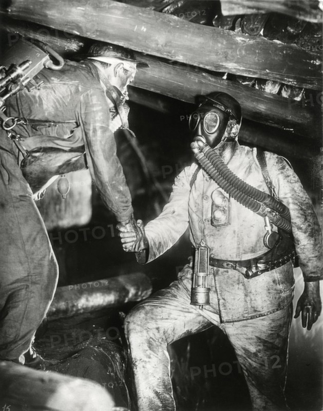 Two Miners, one Wearing Gas Mask, Shaking Hands, on-set of the Film, "Kameradschaft", 1931